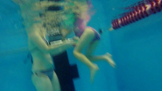 mom  and daughter pool in the family swimming underwater boy and man dive girl and woman