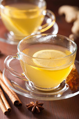 hot lemon ginger cinnamon tea in glass cup