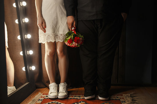 man and woman couple holding hands