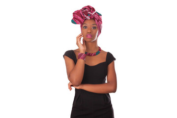 Young beautiful african woman wearing a traditional headscarf