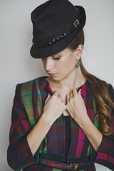 A large portrait of a girl with hat color and the jacket 4952.