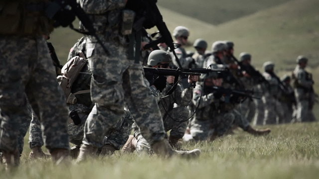 Line of soldiers alternating shooting in kneeling stance