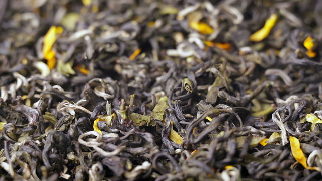 Green tea leaves close up rotation