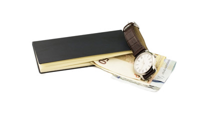 The euro, notebook and wristwatch