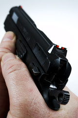 man pointing a weapon and weapon charges