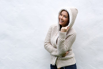 Young woman laughing with wool sweater