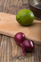 Fototapeta na wymiar Two onions with lime