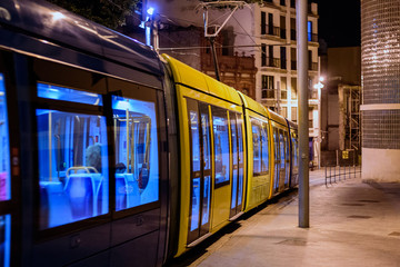 Fototapeta na wymiar Tram in a night street of old town in Santa Cruz de Tenerife