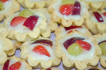 A lot of sweet desserts and fruit