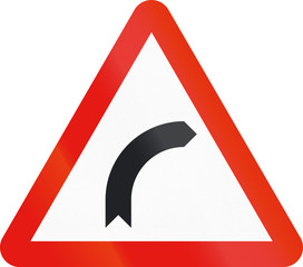 Road sign used in Spain - Dangerous curve to the right