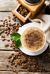 Hot coffee and pastries on a wooden background