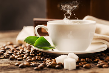 Hot coffee and pastries on a wooden background