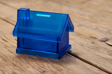 Piggy bank for coins in the form of home