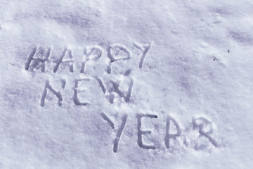 Happy New Year message on a snow field, filter applied