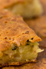 Macro view of homemade pie with ham cheese and cucumber