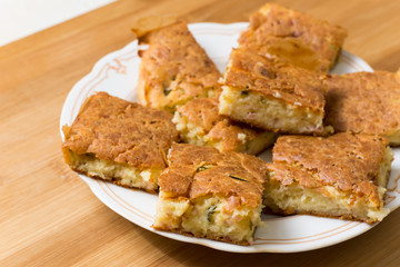 Served pie with cheese cucumber and ham