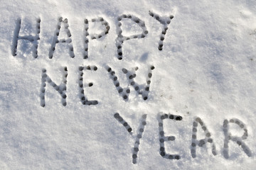 Happy New Year message on a snow field, filter applied