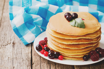 delicious pancakes on a wooden table with nuts