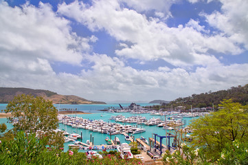 Fototapeta premium Luxury cruisers rest at their berths in Hamilton Island marina. 