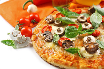 Delicious pizza and fresh vegetables on white background, close up