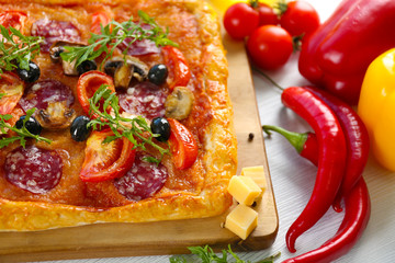 Rectangle delicious pizza on the table, close-up