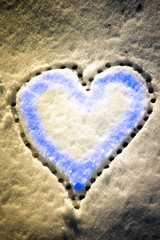 Snow with drown heart shape. Vintage filter applied.