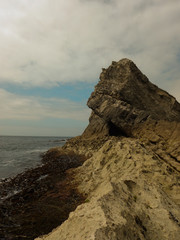 Fototapeta na wymiar Sea Side Cliff with Cave 