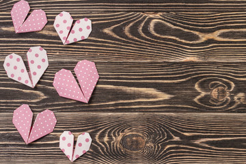 Fototapeta premium Handmade hearts against wood-grain wall
