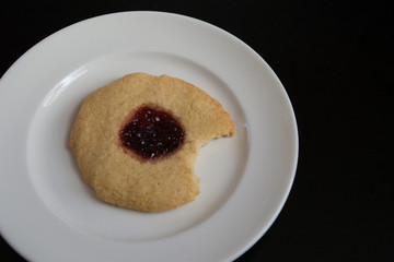 Thumbprint cookie on white plate