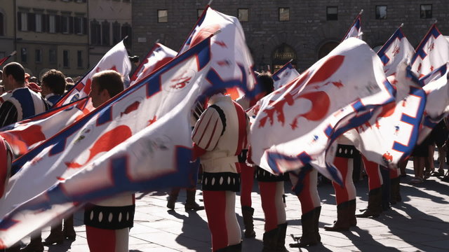 Clip of men in fancy attire in a parade in Italy.
