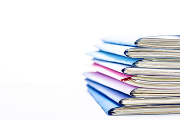 Stacked files. On white background with copy space on the left side.