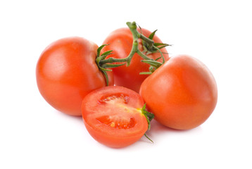 whole and half cut tomato with stem on white background