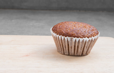Banana muffin cake on wooden board