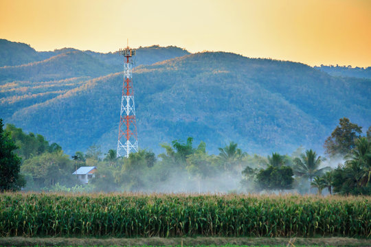 Telecommunication tower on the field