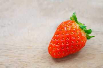 Fresh strawberries on wooden background