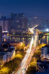 Fototapeta na wymiar Guangzhou, China-Jan. 7, 2015: City night view. Busy traffic sce