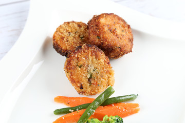 Crab cakes with vegetables