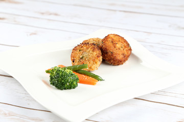 Crab cakes with vegetables