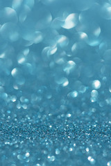 Blue glitter bokeh abstract light background