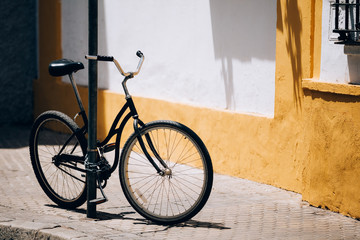 Fototapeta na wymiar Black bicycle parking on street In European City