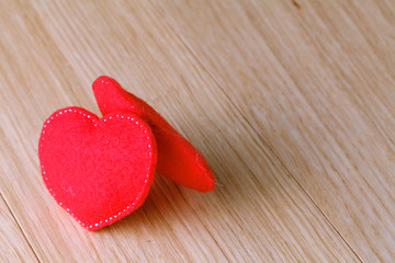 Valentines day toy hearts on wooden table. View with copy space