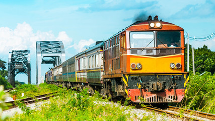 Naklejka premium Overnight passenger train was passing through steel bridge, 2013.
