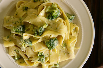 Pappardelle pasta with four cheese sauce and broccoli