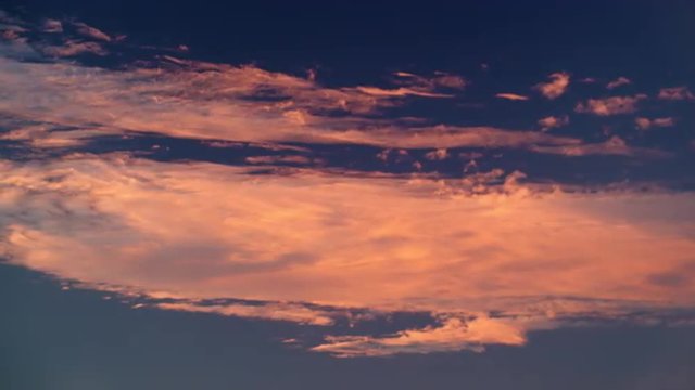 Royalty Free Stock Video Footage of white and orange clouds at sunset shot in Israel at 4k with Red.