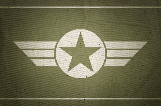 Military army star with old fabric texture background