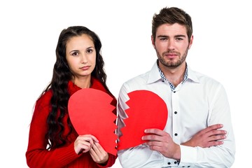 Couple holding heart halves