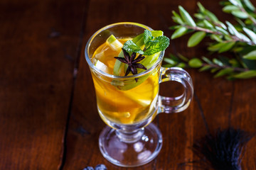 Fruit tea with lemon and Apple in glass Cup