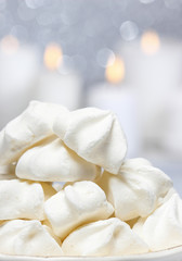 Fototapeta na wymiar White meringues in christmas setting