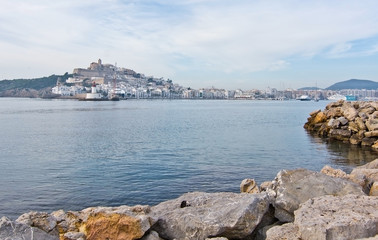 Fototapeta na wymiar Dalt Vila on Ibiza Town hill across the bay