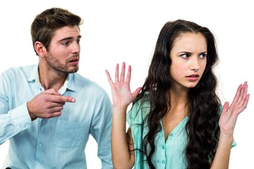 Couple sitting on chairs having argument